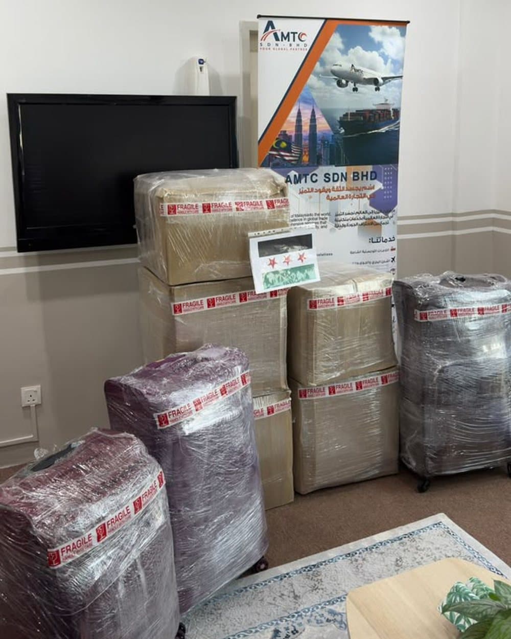 Wrapped boxes and suitcases at the AMTC office