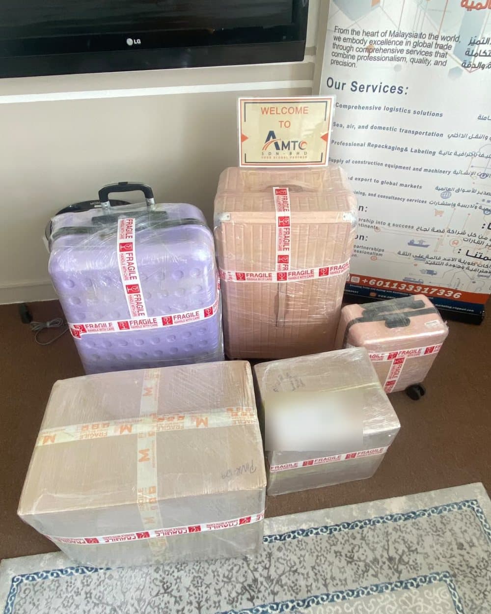 Suitcases and boxes, wrapped and ready to ship
